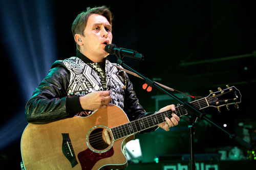 Mark Owen playing guitar