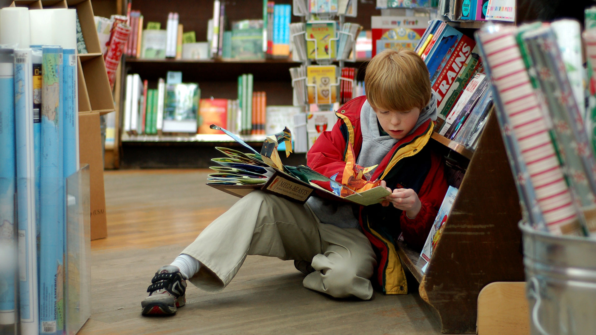 Child reading in library