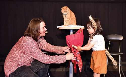 Japanese girl gives flowers to James Bowen and Street Cat Bob before the screening of TV show, Unbelievable