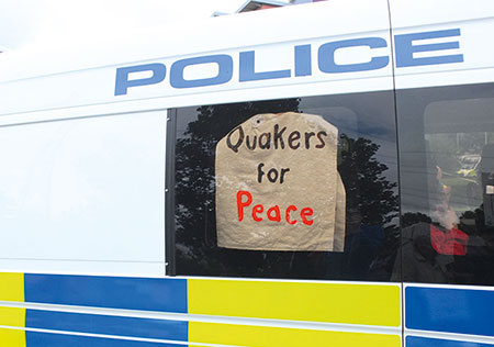 Quakers for Peace sign in police van