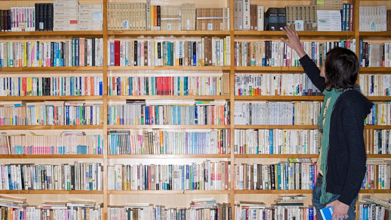 Man looks at books in bookshop