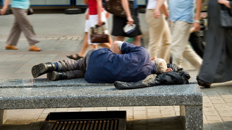 Homeless man on bench