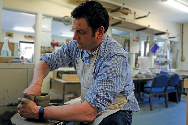 Craig Mealing at the potter's wheel