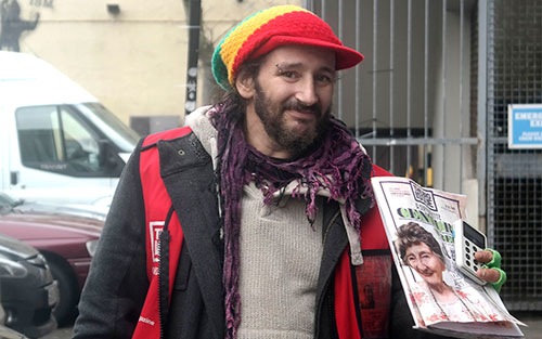 Big Issue vendor Robin Fabian with card reader