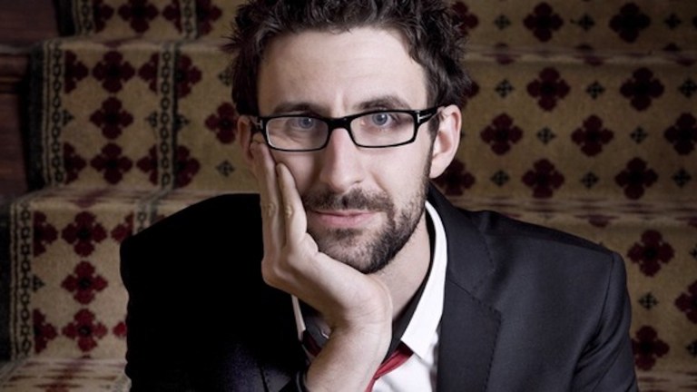 Mark Watson stares into the camera