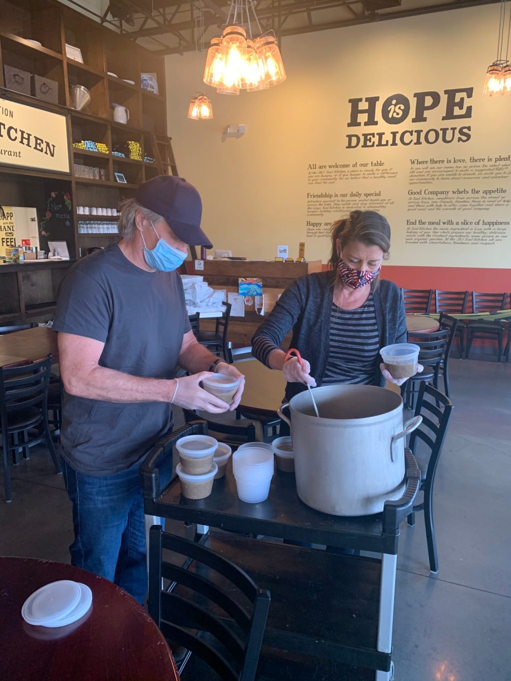 Jon Bon Jovi and his wife Dorothea portion out soup at the JBJ Soul Kitchen