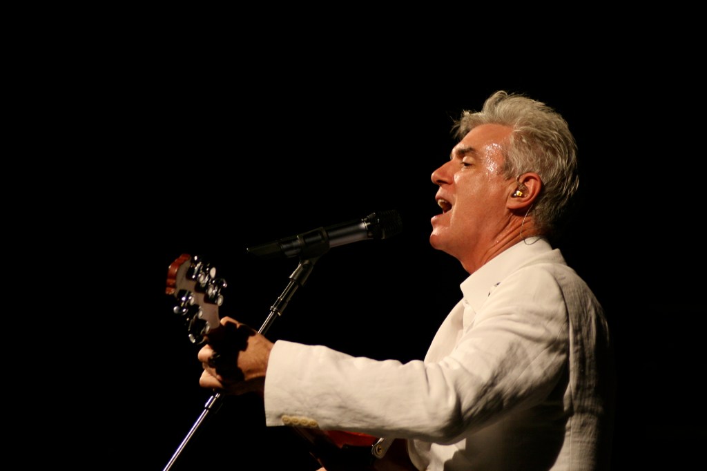 David Byrne performs in a white suit in Barcelona