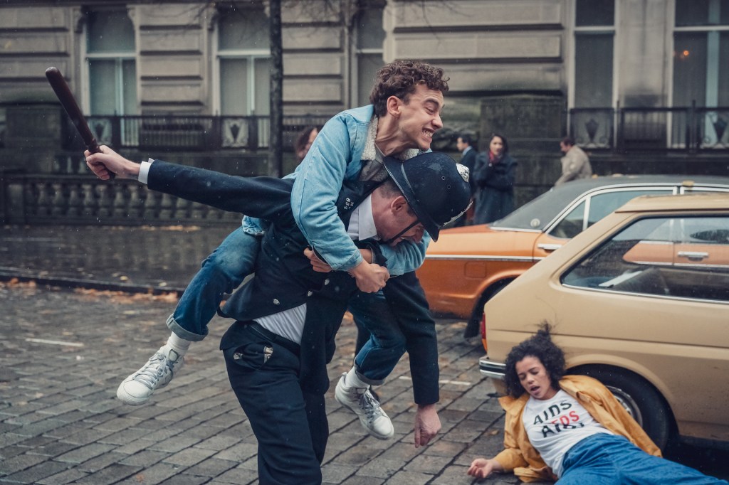 Richie, played by Olly Alexander, tussles with police at a protest