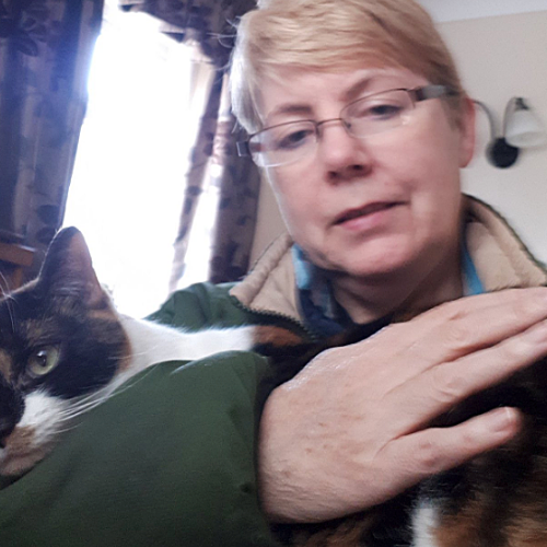 Adele, an RAF veteran who saw her pet services business unable to trade during the first lockdown, with her cat Poppy
