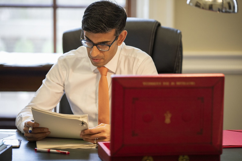 Chancellor Rishi Sunak in Downing Street with briefcase ahead of budget announcement