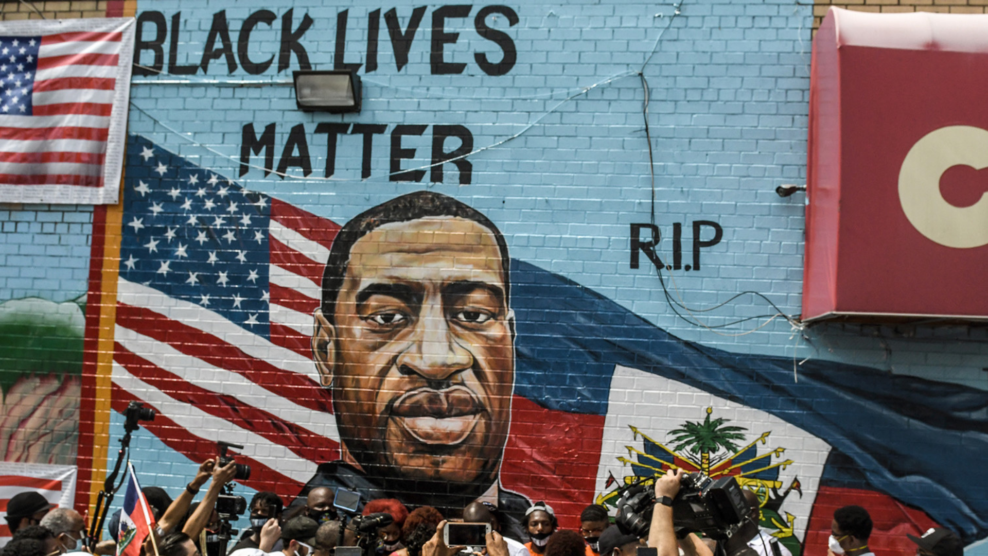 NEW YORK, NY - JULY 13: A mural painted by artist Kenny Altidor depicting George Floyd is unveiled on a sidewall of CTown Supermarket on July 13, 2020 in the Brooklyn borough New York City. George Floyd was killed by a white police officer in Minneapolis and his death has sparked a national reckoning about race and policing in the United States. (Photo by Stephanie Keith/Getty Images)