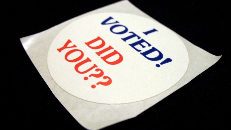 A voting sticker says 