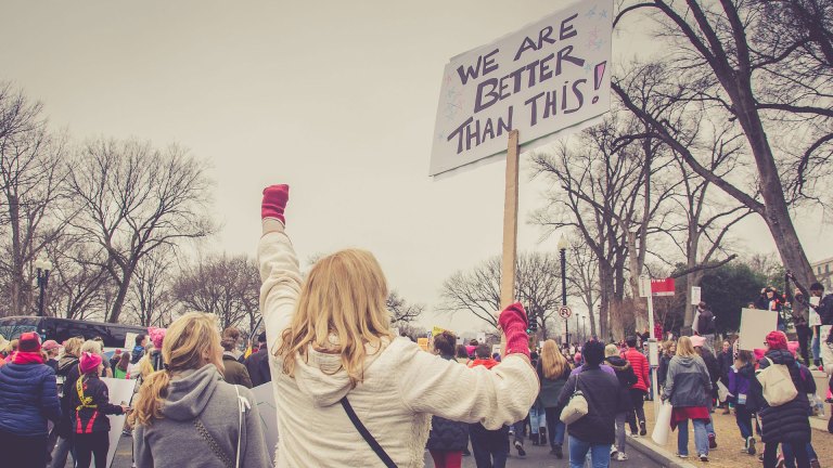 women marching against Violence against women