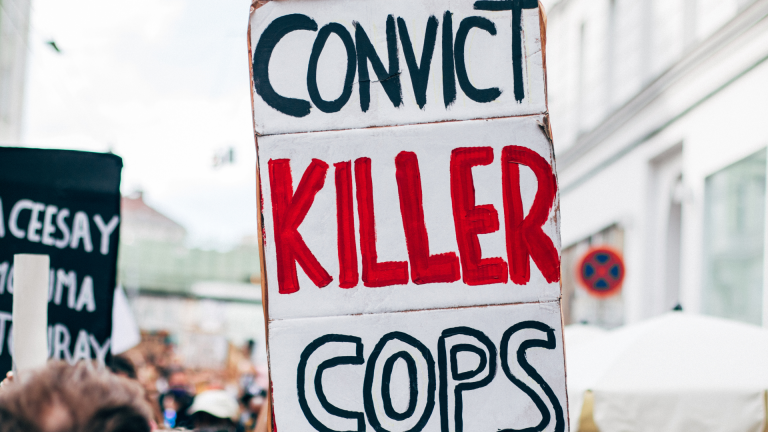 Black Lives Matter Austria, close-up picture of Convict Killer Cops sign. Image credit: Ivan Radic / Wikimedia Commons