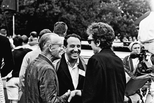 Dylan biographer Robert Shelton (centre) introduces him to fiddler Clayton McMichen (left) in 1964.