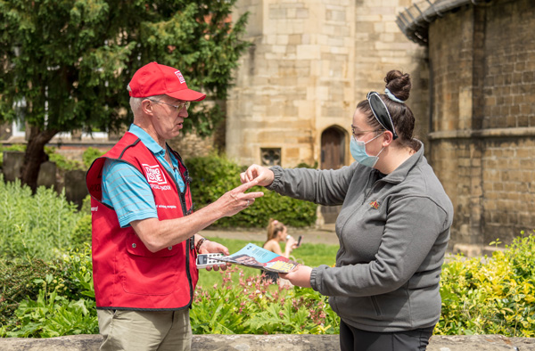 The Archbishop of Canterbury makes a sale when he tries his luck as a Big Issue vendor.