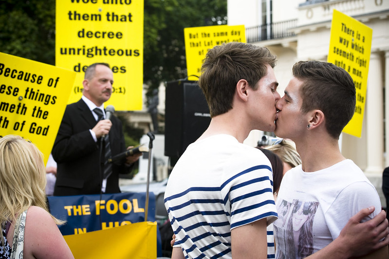 Men kiss in front of evangelical protestors at London's Pride, 2011.