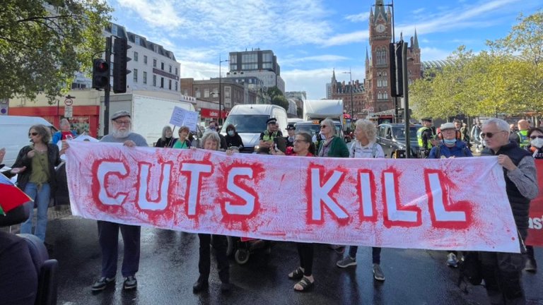 Disabled activists march on Euston Road to protest against legacy benefits decision