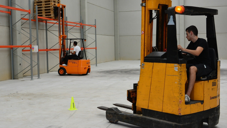 Students learn how to drive a fork-lift truck