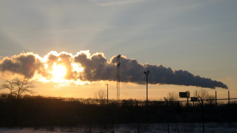 Pollution cuts across the early morning sun