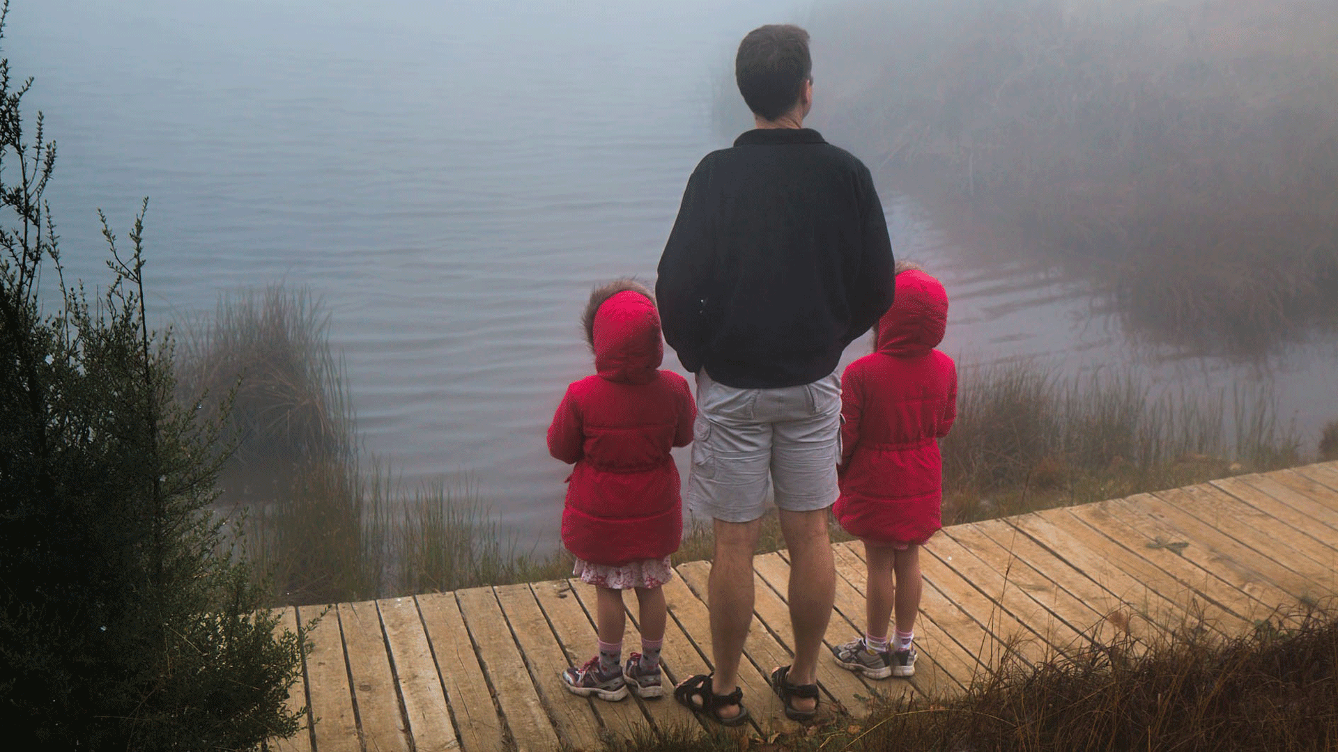 Twin girls with their dad