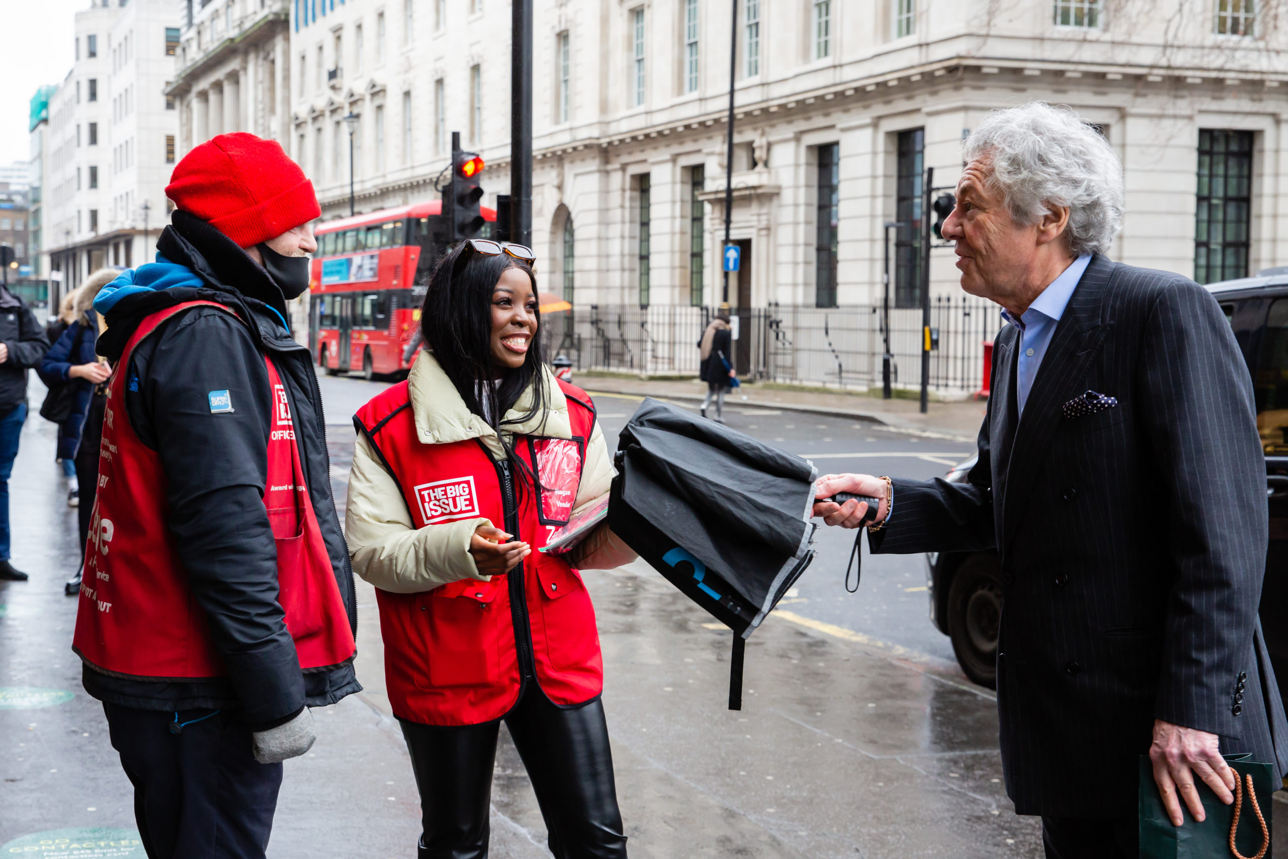 Kaz Kamwi and vendor Paul Logan team up to sell the Big Issue. Image: Louise Haywood-Schiefer