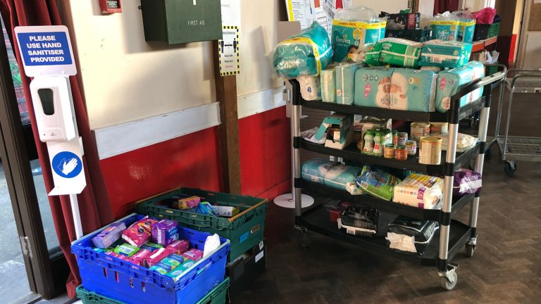 Food bank supplies on trollies.