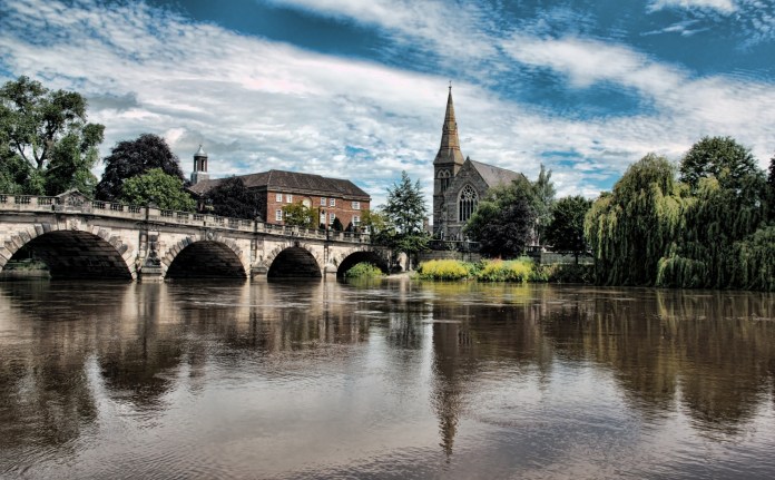 River with bridge and church in background.