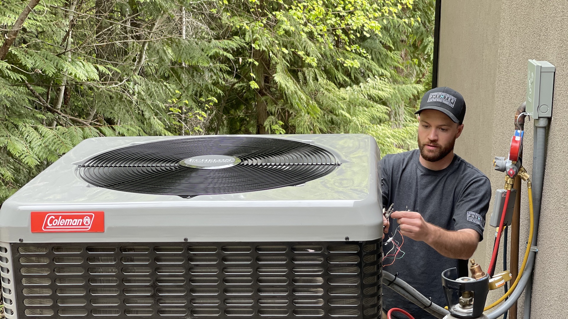 An engineer installs a heat pump, which can be on the large side