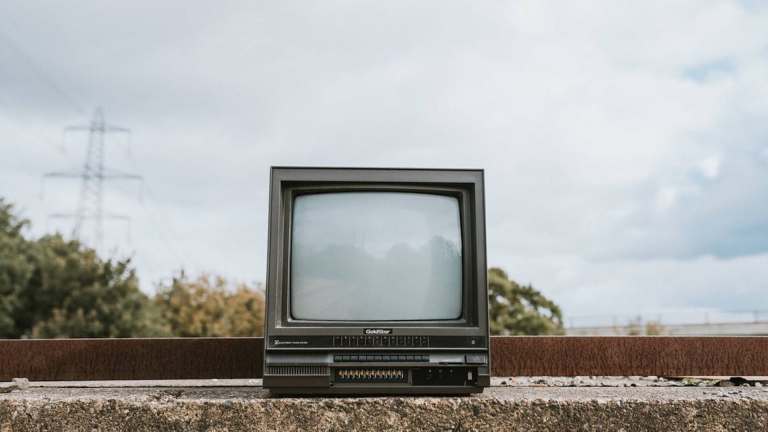 Old CRT tv amid urban wasteland