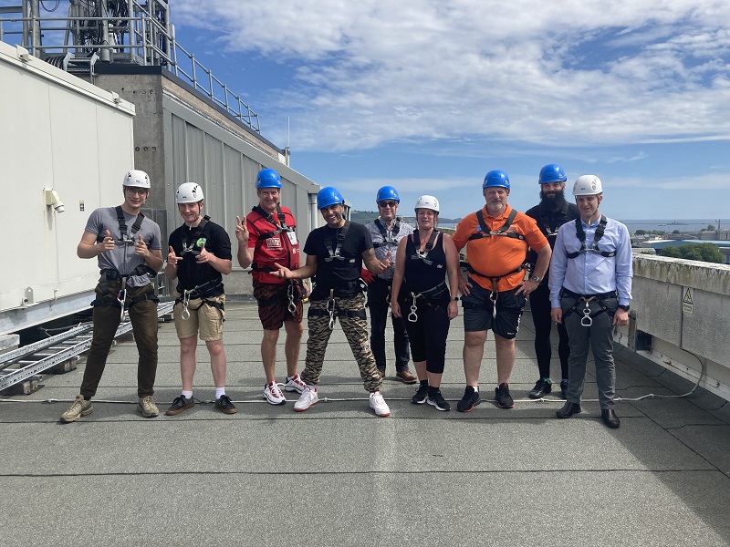 Big Issue vendor Clive abseil