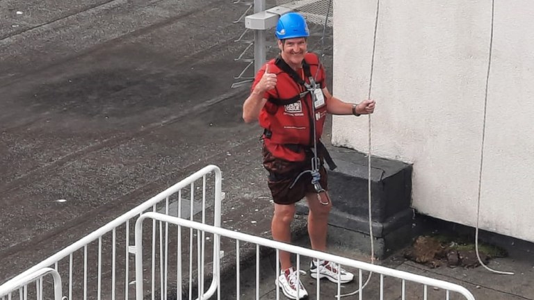 Big Issue vendor Clive abseil