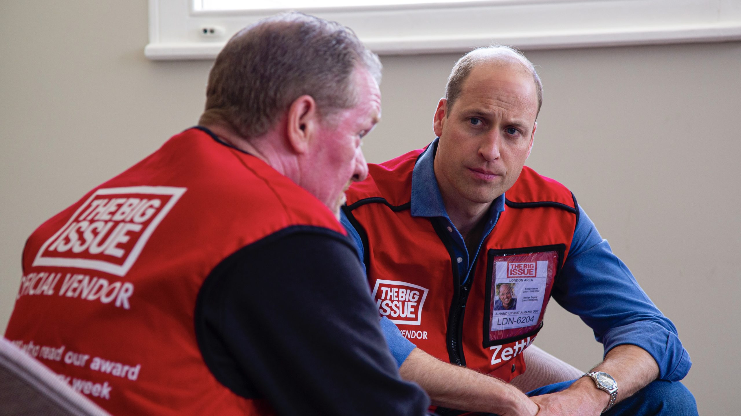 Prince William looking at Dave Martin in a one-to-one conversation.