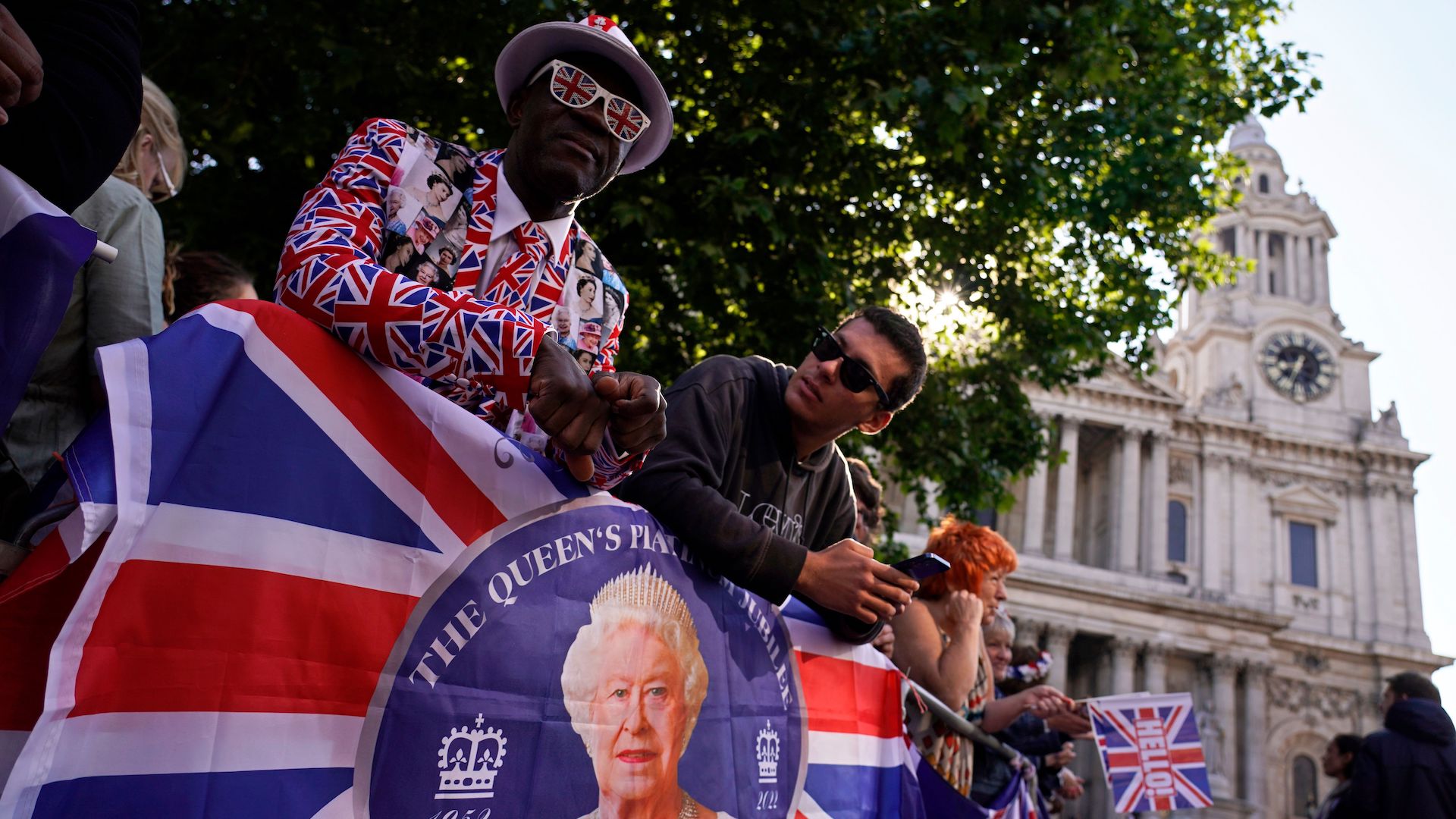 People gather outside St Paul's Cathedral, in the background, to watch the arrivals for a service of thanksgiving for the reign of Queen Elizabeth II in London, on the second of four days of celebrations to mark the Platinum Jubilee.