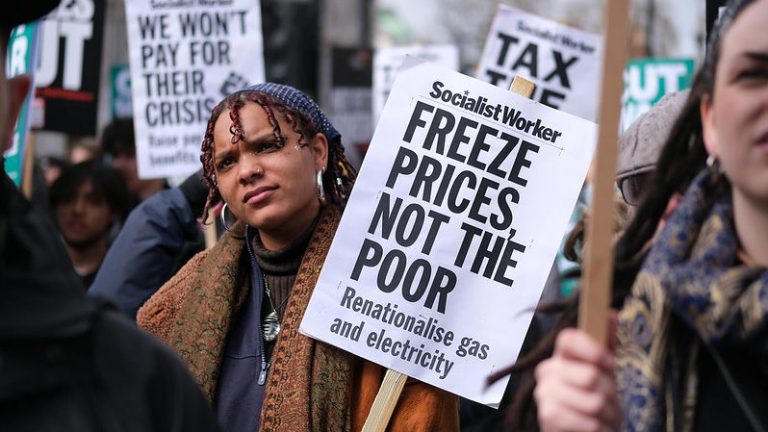 A protester with a placard reading: 