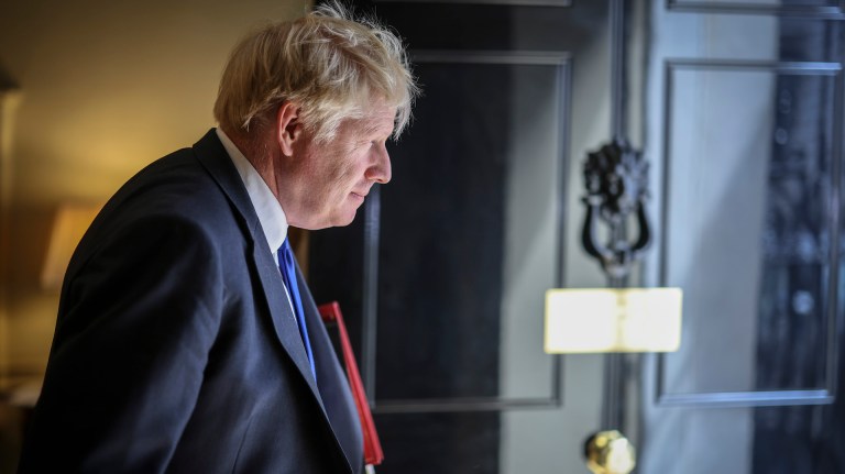 Boris Johnson looks out of the door at Number 10.