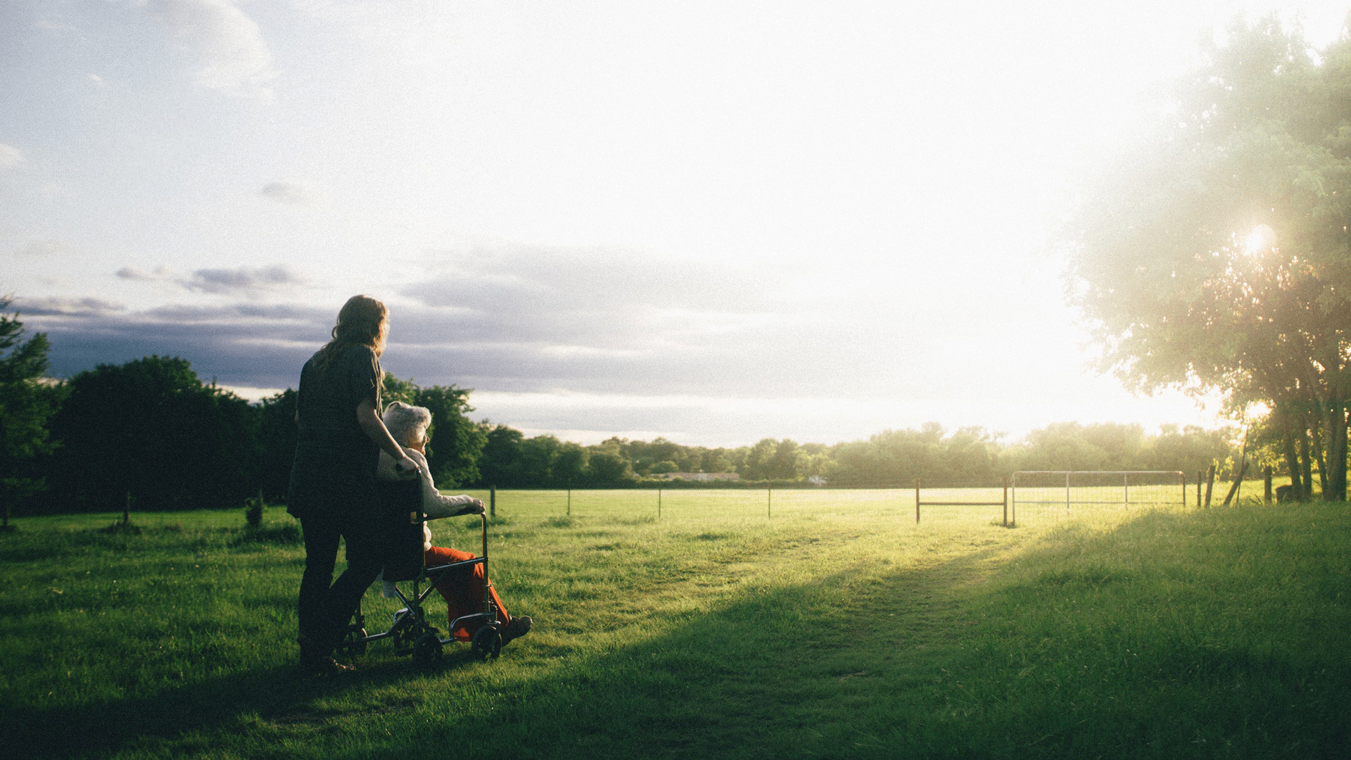 Woman in wheelchair with carer