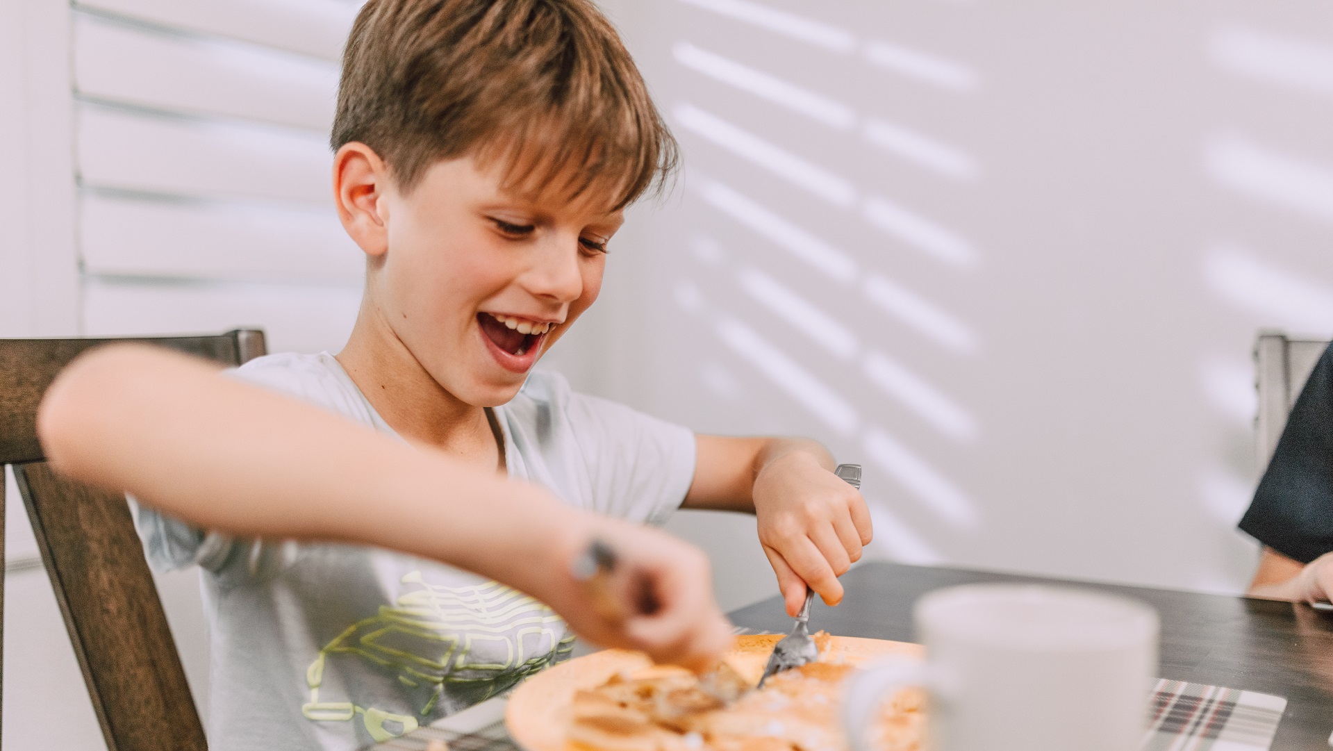 Cooking for the family on a tight budget/ Image of child eating