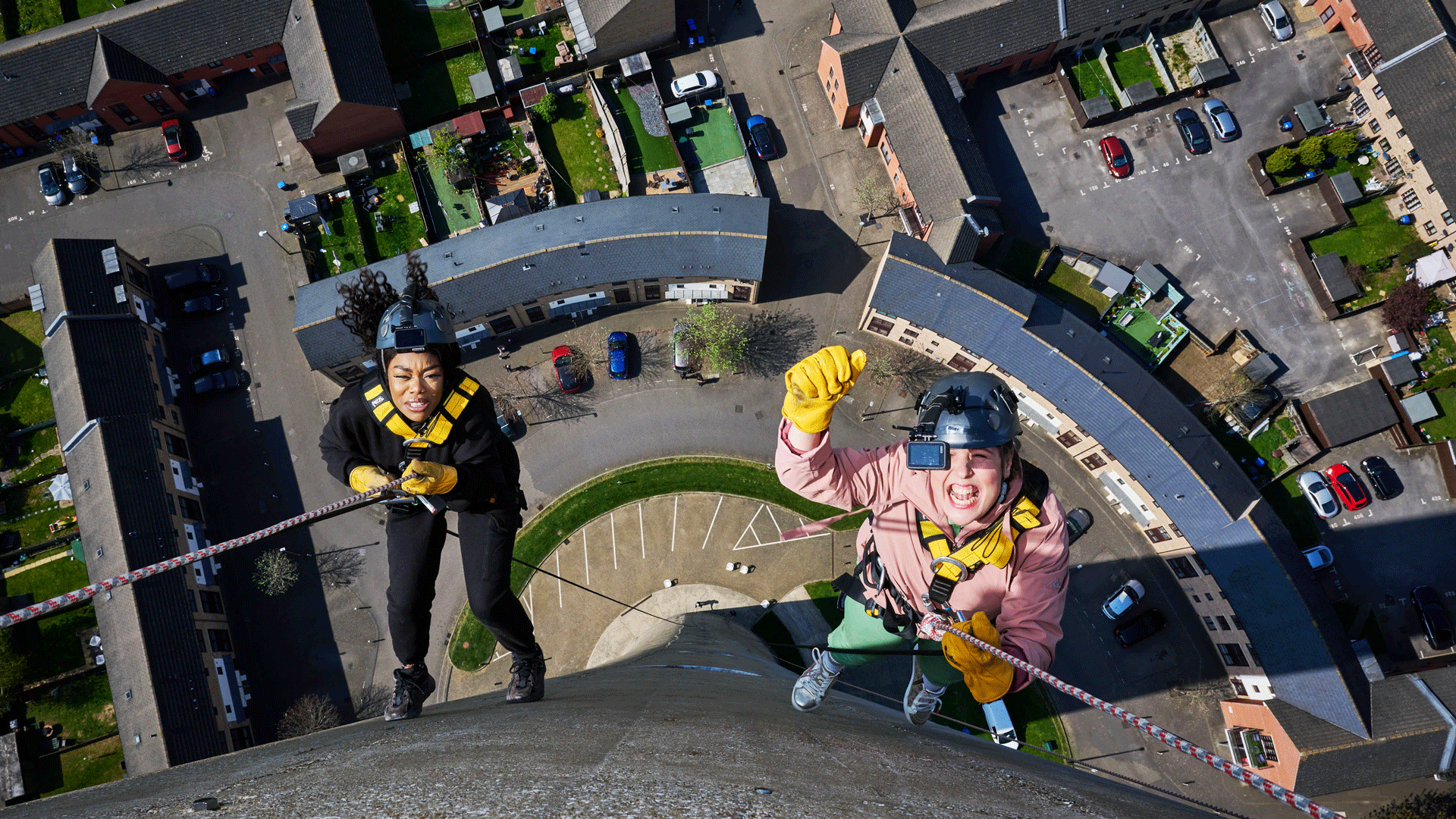 Lady Leshurr and Rosie Jones abseil the National Lift Tower in Northampton for Channel 4's Trip Hazard