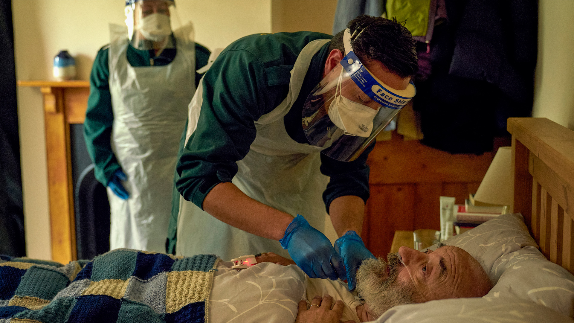 This England - a patient in a hospital bed is treated by doctors