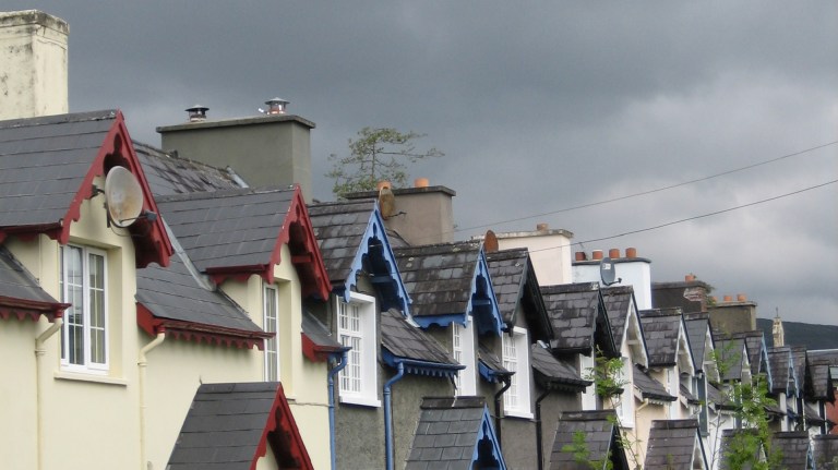 a horizontal view of the top floors on a row of terraced houses