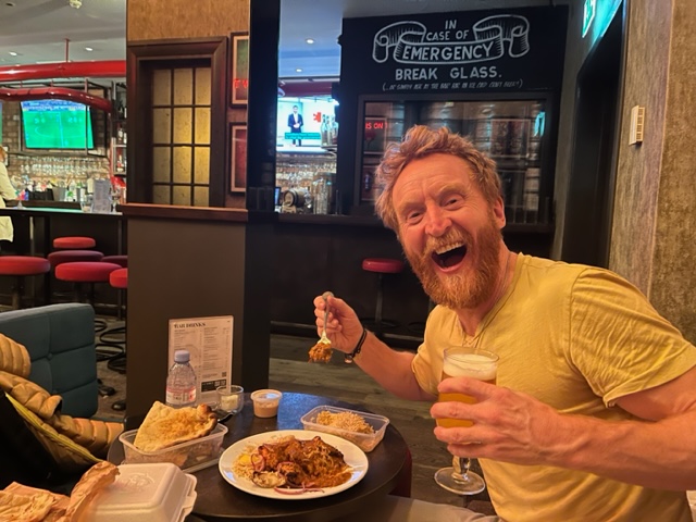 Actor Tony Curran eating a curry and drinking beer during filming of Mayflies. Taken by actor Martin Compston. 