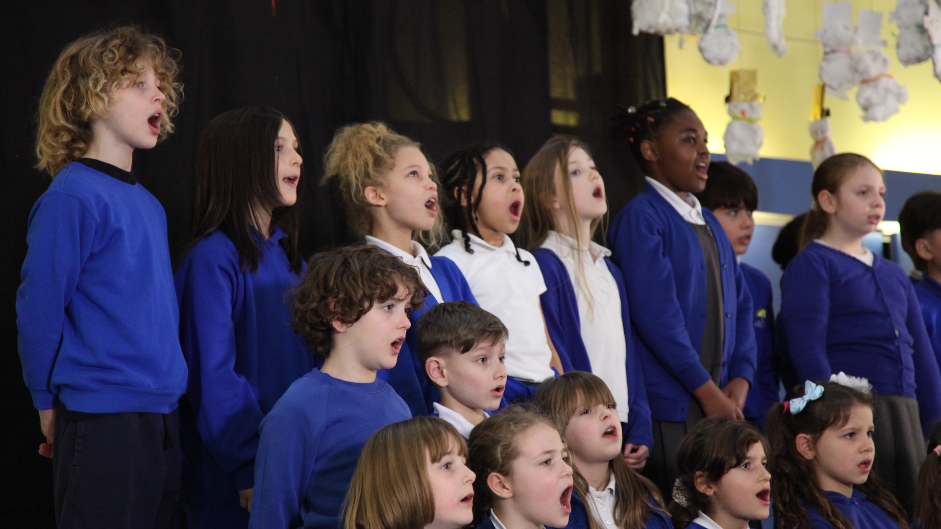 children singing at Barn Croft school