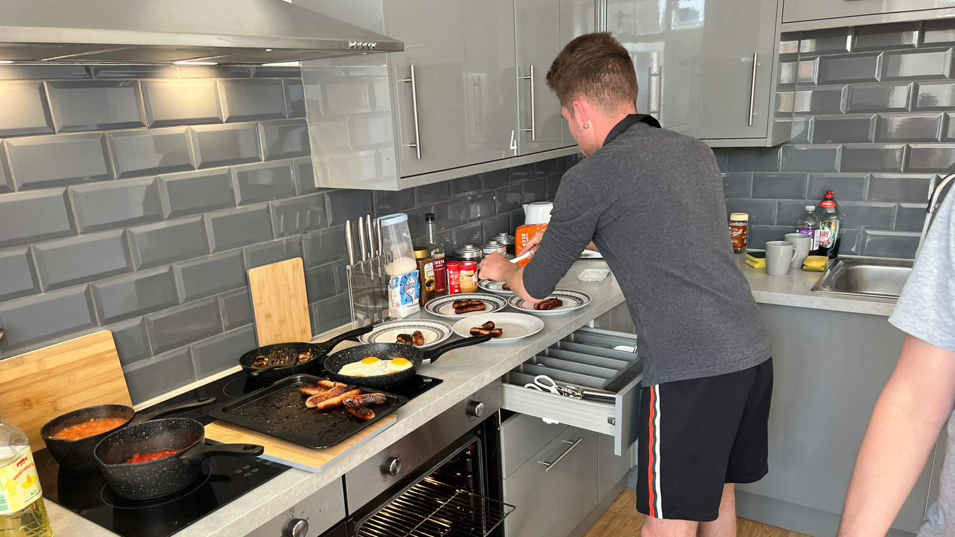 A man in a kitchen at Rene House