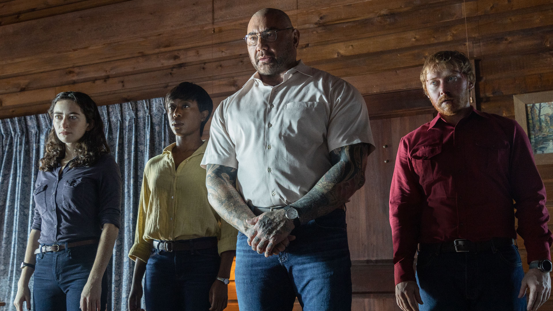 Abby Quinn, Nikki Amuka-Bird, Dave Bautista and Rupert Grint in Knock at the Cabin