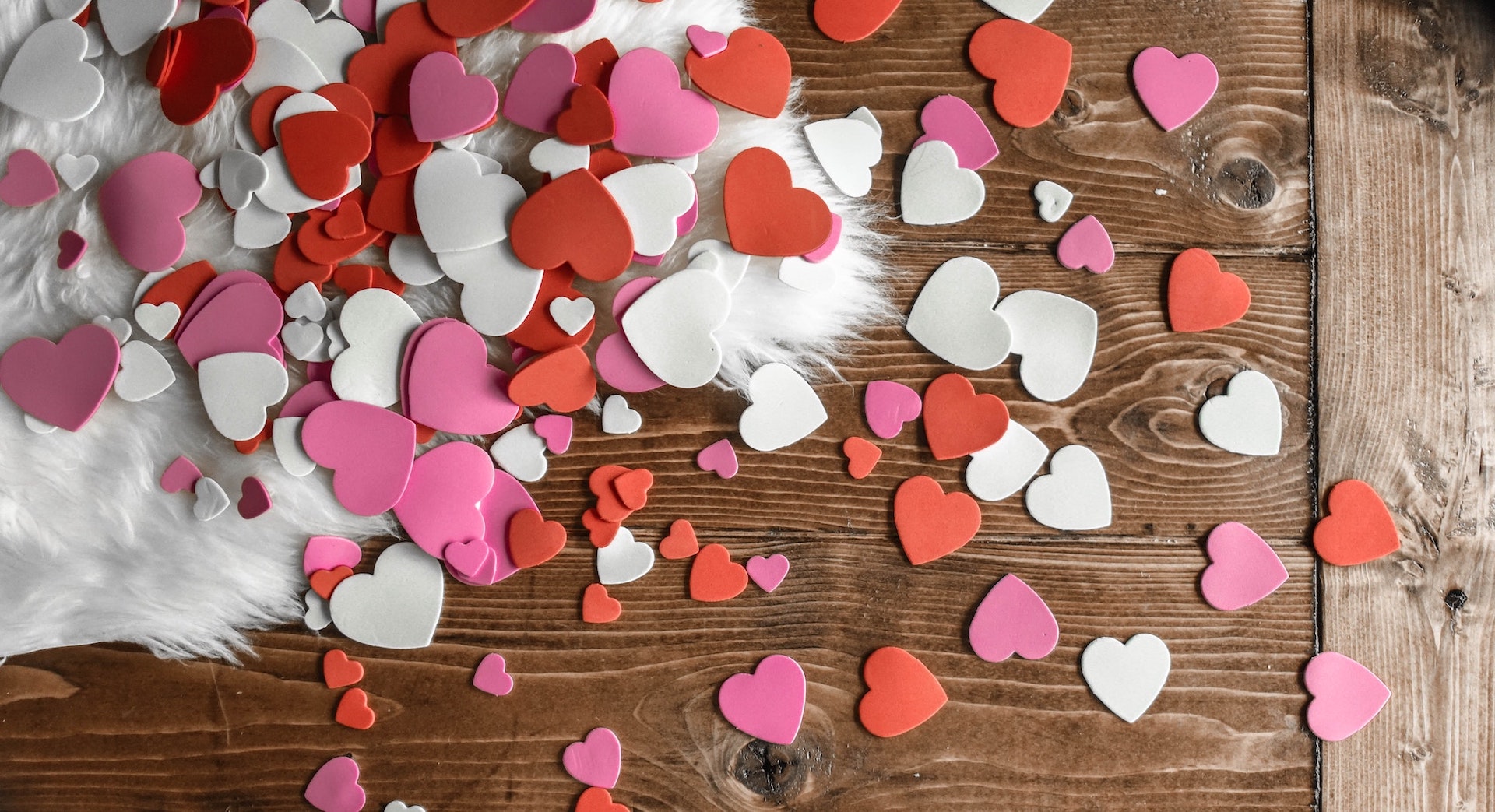 heart shaped paper scattered on desk