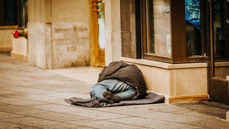 A person sleeping on the street