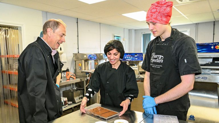 Prince Edward, the Duke of Edinburgh, co-founder of Harry Specters Mona Shah, and employee Bruce Hall create a chocolate bar for the royal visit. Image: Harry Specters