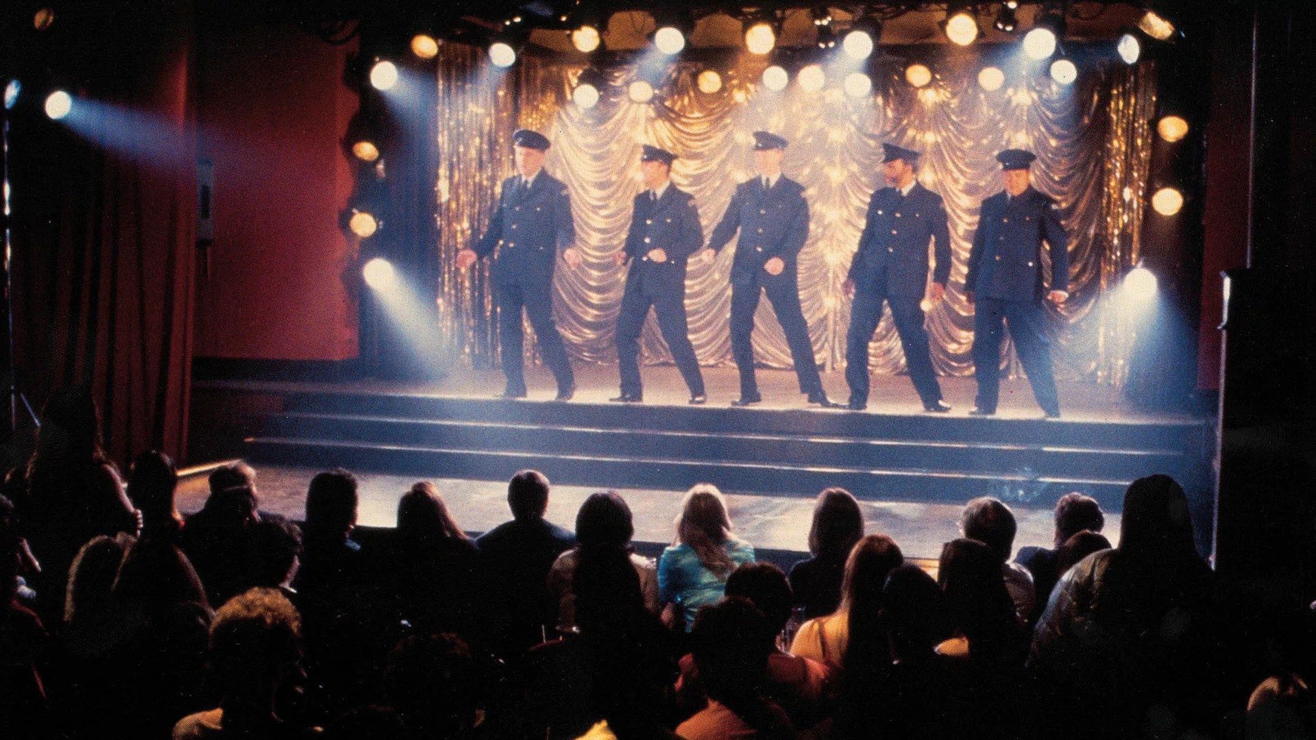 The Full Monty cast on stage in the original film