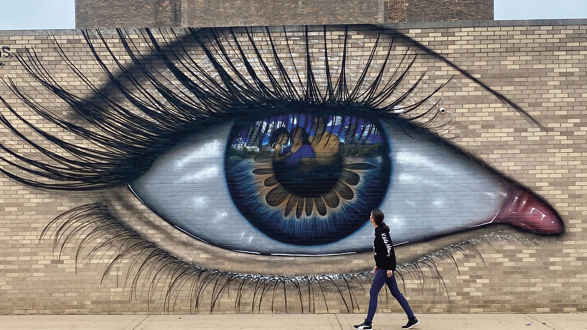 Large-scale mural of an eye by My Dogs Sighs in Jackson, Michigan (2020)